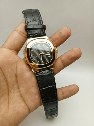 Patek Philippe Nautilus – Yellow Gold Black Dial Black Leather Strap